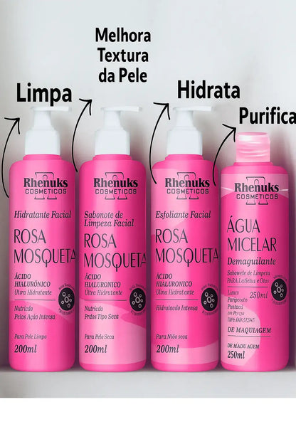  Kit completo de cuidados faciais com quatro produtos: água micelar, sabonete facial, esfoliante e hidratante, todos com ácido hialurônico, dispostos à frente de uma caixa personalizada.